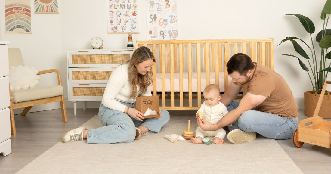 Mom and dad bonding with their baby in a well-organized nursery room, creating a warm, loving, and cozy family environment.