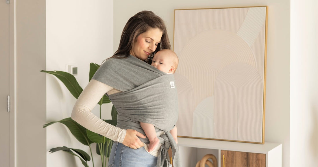 Mother babywearing her baby safely using the T.I.C.K.S. rule.
