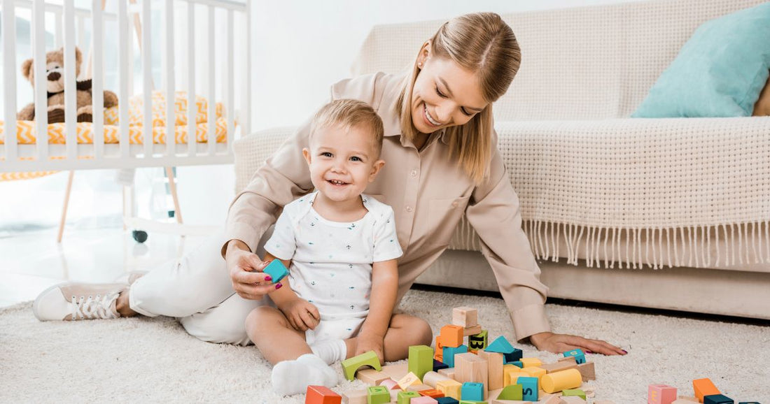 Mom and baby enjoying playtime in a comfortable nursery room with organized baby essentials.