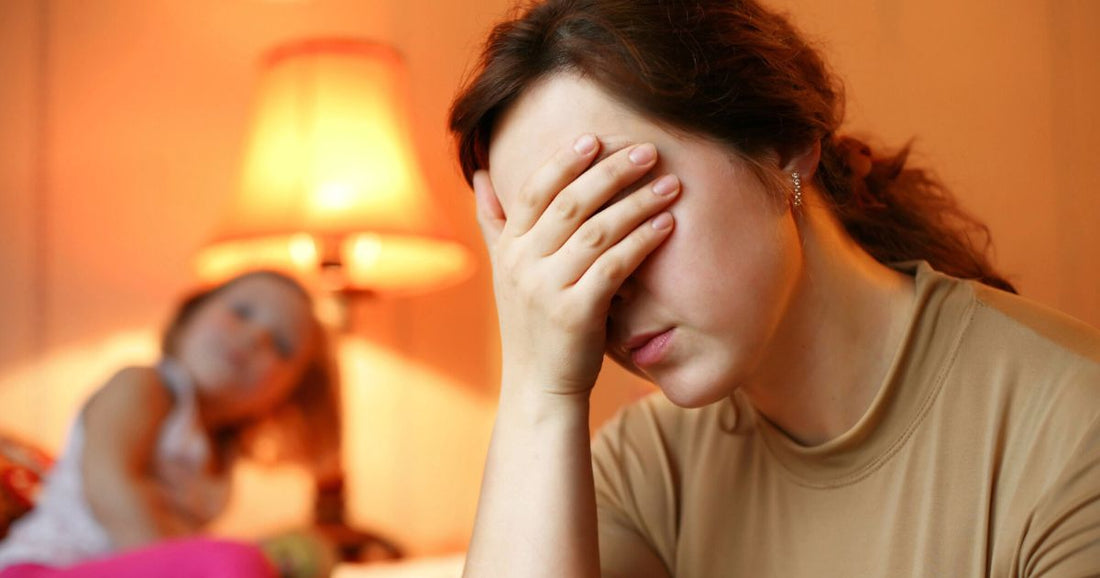 Tired woman longing for rest after a stressful day, struggling to stay awake.