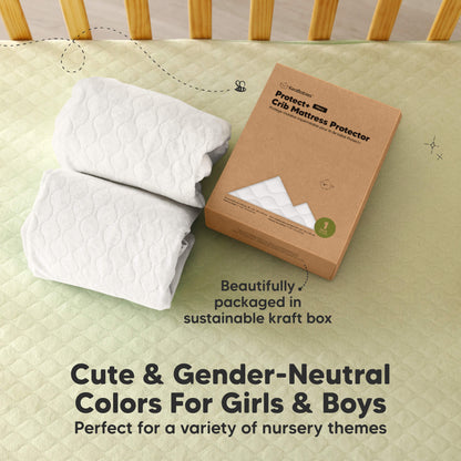 2-pack crib mattress protectors in gender-neutral colors, packaged in a sustainable kraft box. 31213585039546