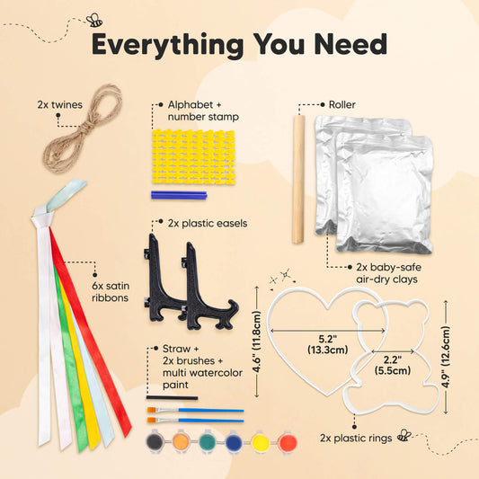 Everything You Need: 2x twines, alphabet + number stamp, roller, 2x baby-safe air-dry clays, 2x plastic easels, 6x satin ribbons, watercolor paint set + 2x brushes + straw, 2x plastic rings (heart: 5.2" / 13.3cm, bear: 4.9" / 12.6cm).-on-hover