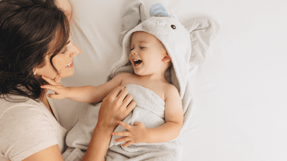 lifestyle video of the playpals hooded towel. 29329541038266