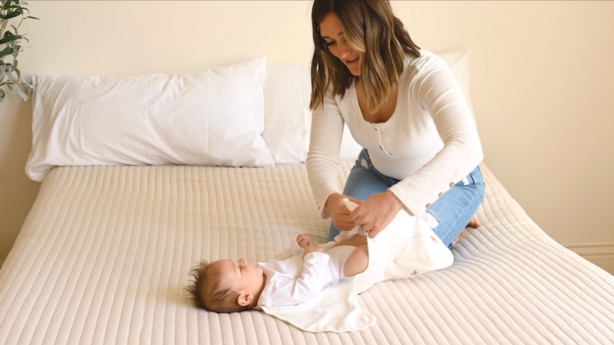Video of parent using the soothe zippy swaddle wrap